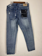 Purple Brand distressed denim jeans.