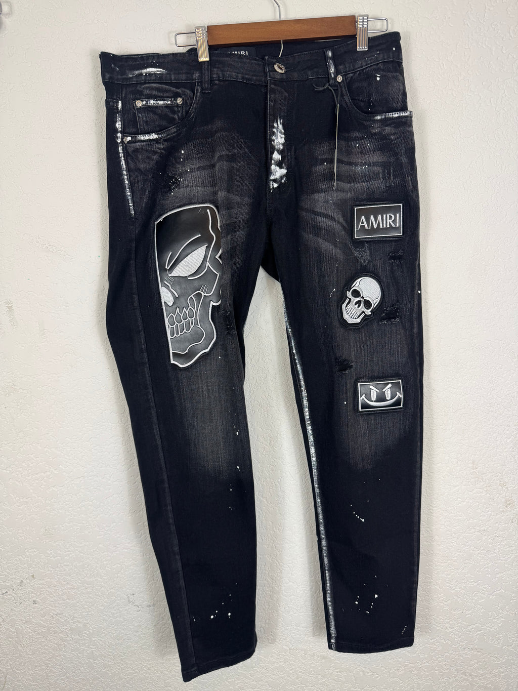 Amiri distressed black patch jeans