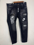 Amiri distressed black patch jeans