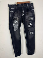 Amiri distressed black patch jeans