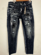 AMIRI distressed varsity patch jeans