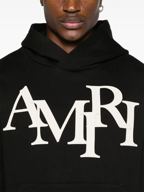 AMIRI Staggered Logo Cotton Hoodie.