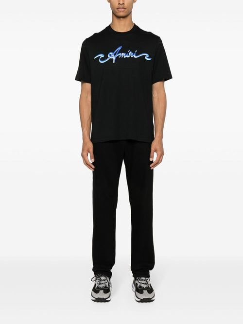 AMIRI Wave Logo Cotton T-Shirt in black.