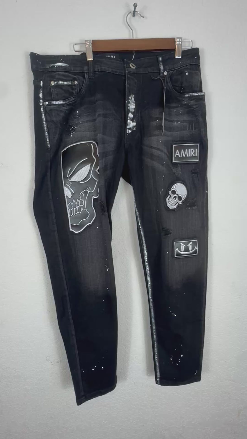 Amiri distressed black patch jeans