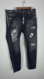 Amiri distressed black patch jeans