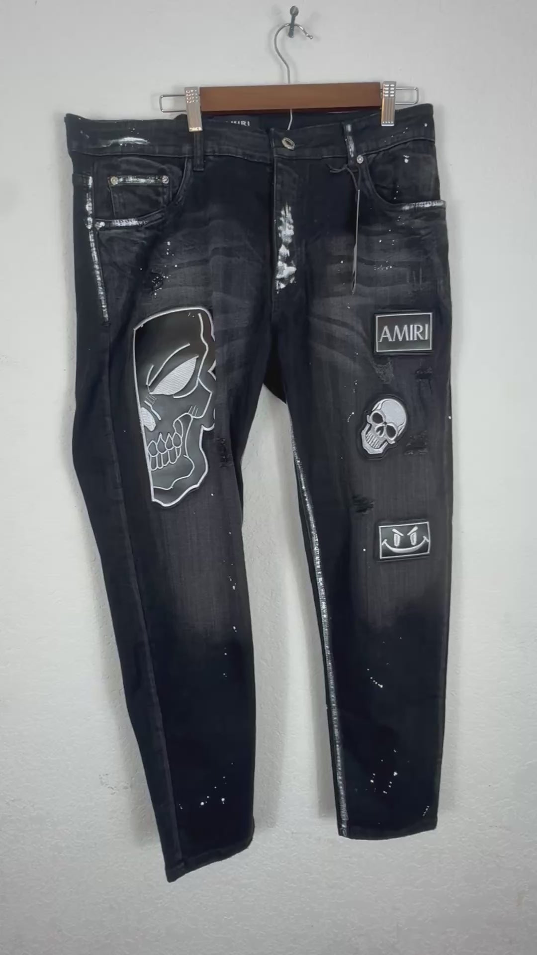 Amiri distressed black patch jeans